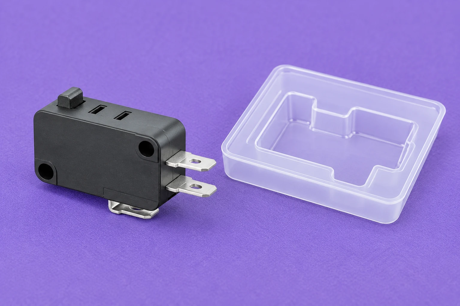 KW7 switch beside a separate empty storage tray on a violet mat KW7 switch beside a separate empty storage tray on a violet mat