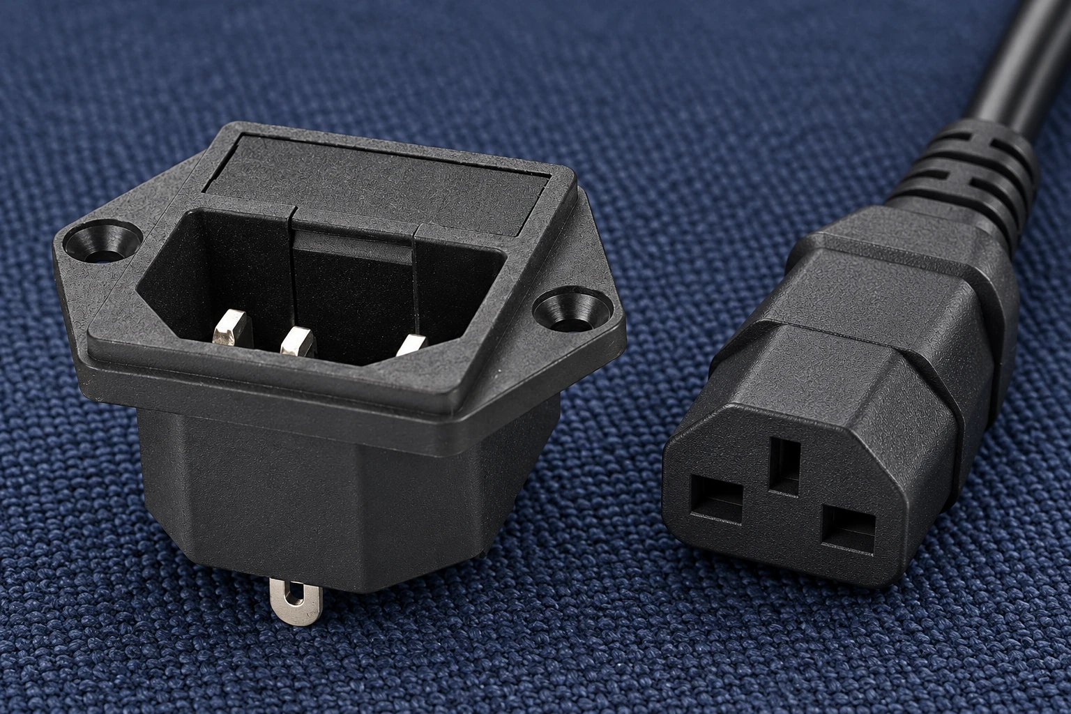 IPZ keyed cavity and three blades beside a disconnected cord connector IPZ keyed cavity and three blades beside a disconnected cord connector