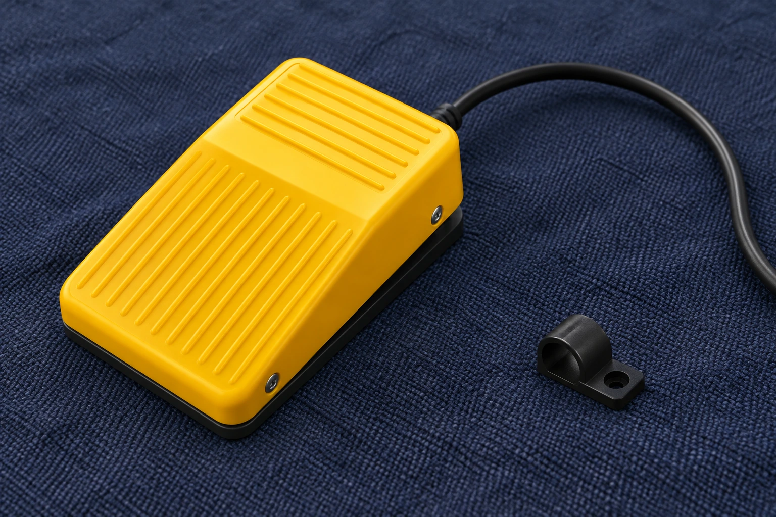 LF-01 pedal cable exit and adjacent loose cable loop on a textile surface