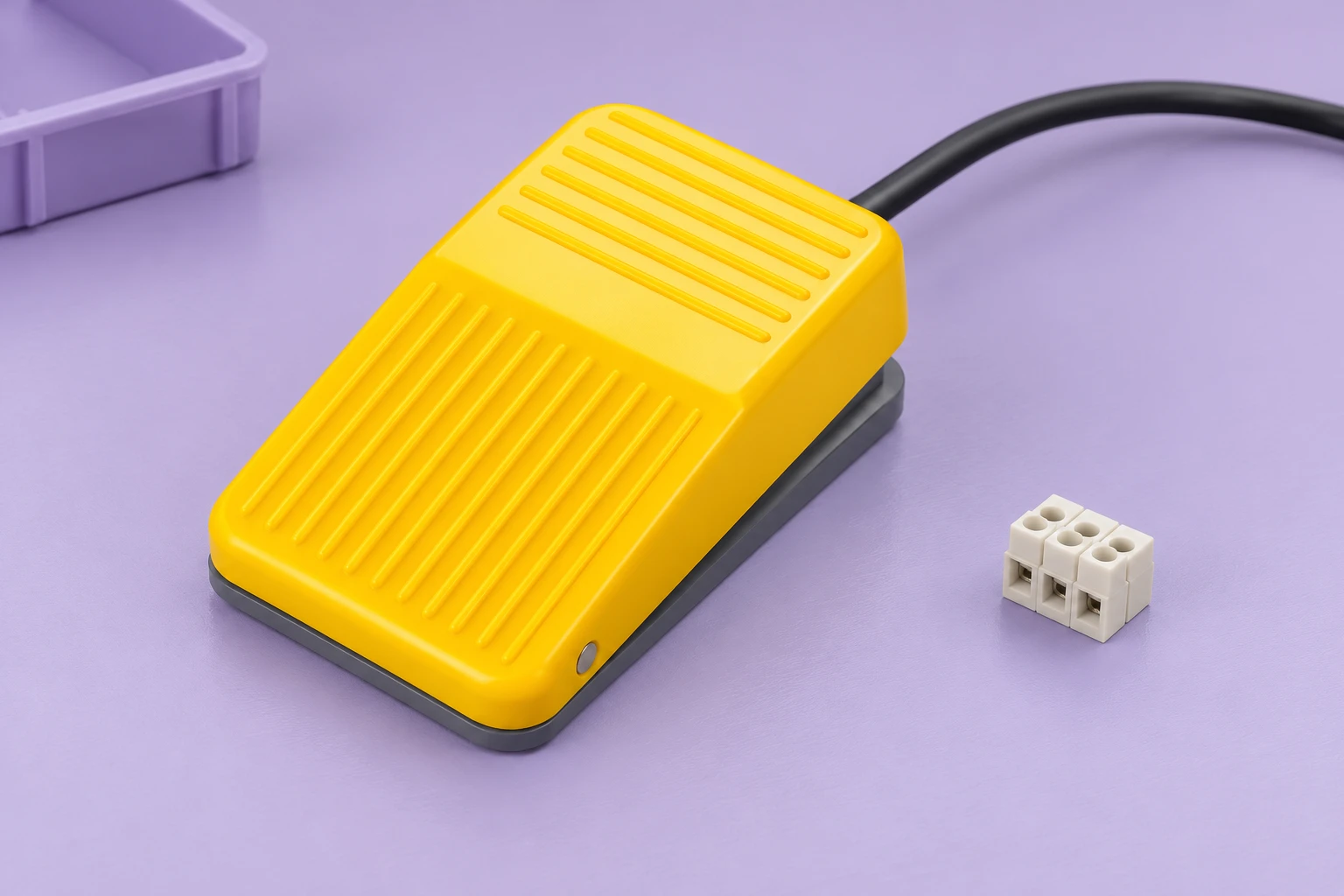 LF-01 pedal with a loose cable beside an unattached terminal connector on a lilac tray LF-01 pedal with a loose cable beside an unattached terminal connector on a lilac tray