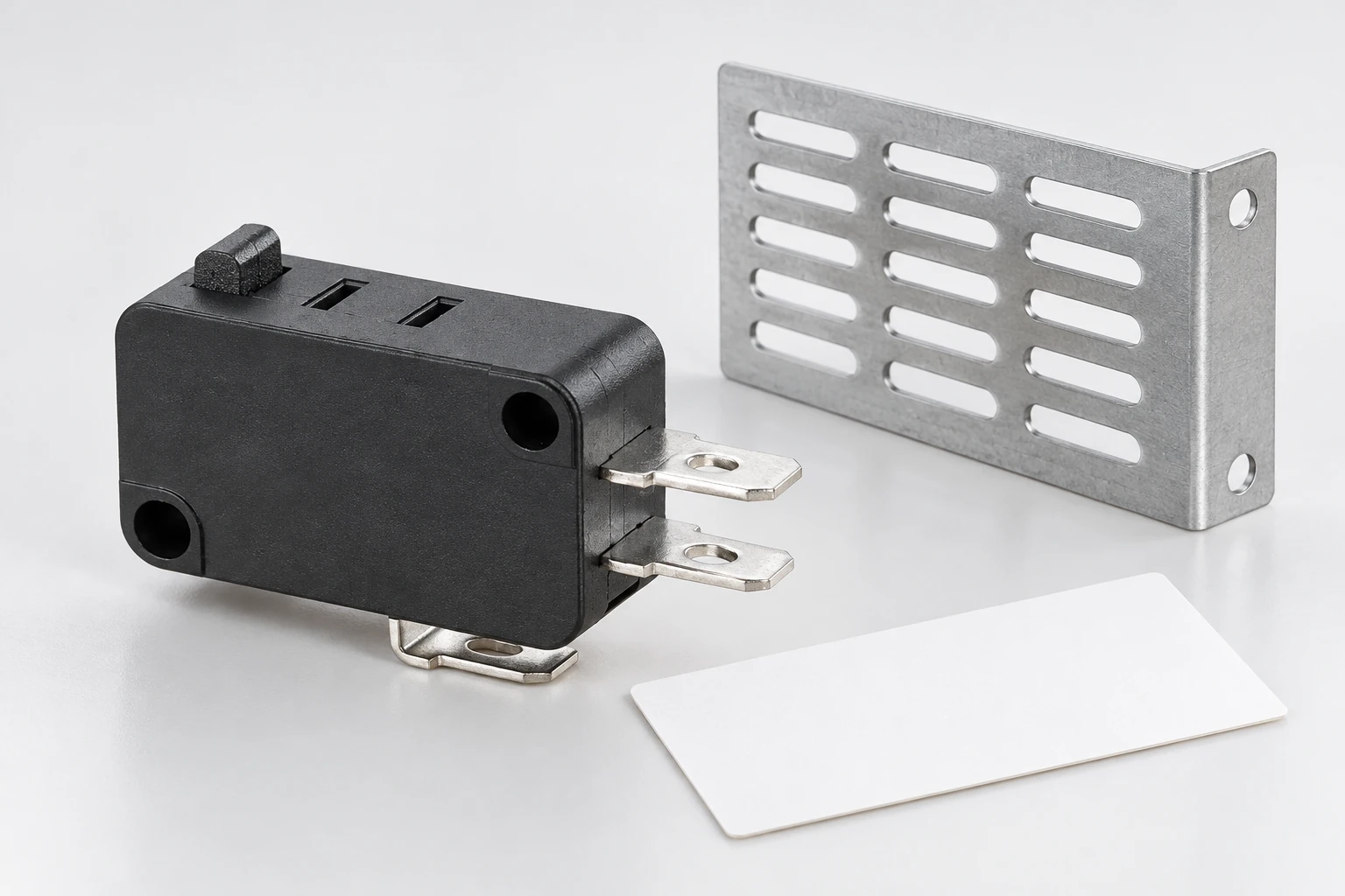 KW7 switch beside a detached ventilated enclosure coupon and blank inspection card
