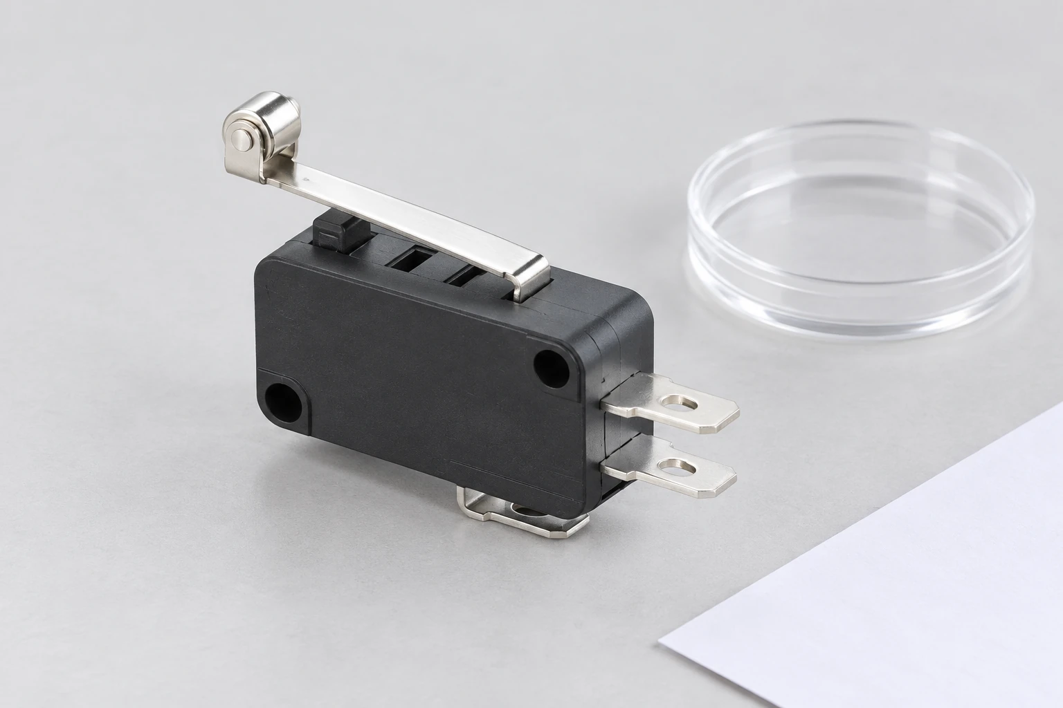 KW7 switch terminals beside a transparent sample dish for identity review