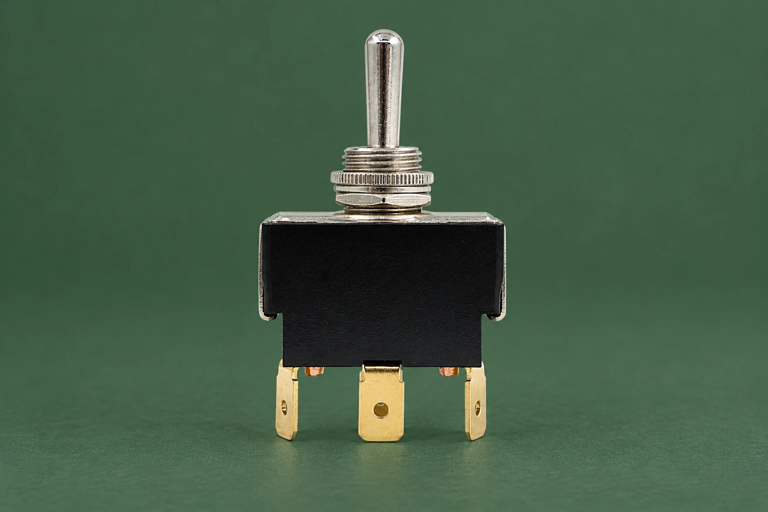 LT-series metal lever, threaded bushing and three brass terminals on a green inspection tile